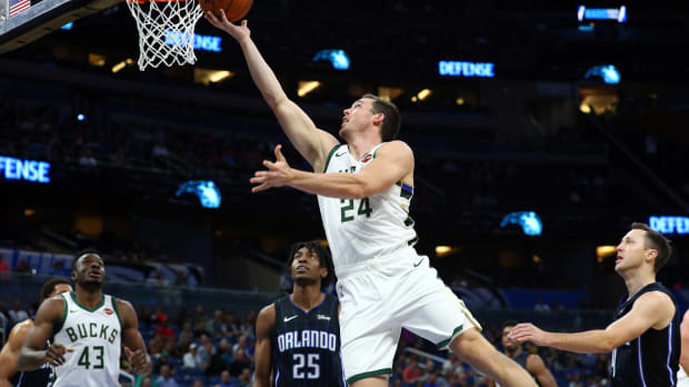 Nov 1, 2019; Orlando, FL, USA; Milwaukee Bucks guard Pat Connaughton (24) shoots a layup against the Orlando Magic during the second half at Amway Center. Mandatory Credit: Kim Klement-USA TODAY Sports